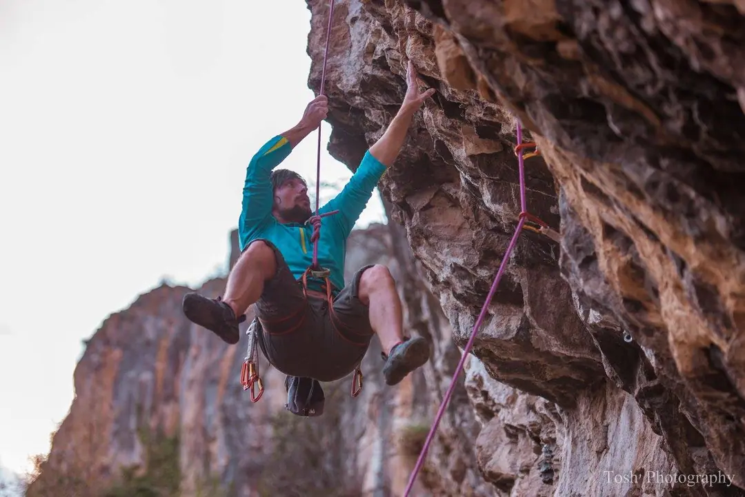 Climbing instructor on an overhanging route